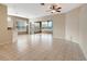 Spacious living room featuring neutral walls and tile floors, and ceiling fan at 10263 Shadow Run Cir, Punta Gorda, FL 33955