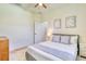 Comfortable bedroom with a large bed, soft decor, and warm lighting at 122 Arrow Ln, Rotonda West, FL 33947