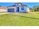 Charming single Gathering home with a manicured lawn and a two car garage at 122 Arrow Ln, Rotonda West, FL 33947