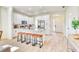 Gourmet kitchen with stainless steel appliances, granite countertops, and island seating at 122 Arrow Ln, Rotonda West, FL 33947