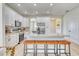 Kitchen with stainless steel appliances, granite countertops, island and seating at 122 Arrow Ln, Rotonda West, FL 33947