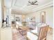 Bright living room featuring a coffered ceiling, neutral colors and an open floor plan at 122 Arrow Ln, Rotonda West, FL 33947