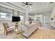 Open-concept living room showcasing a smooth transition to the modern kitchen at 122 Arrow Ln, Rotonda West, FL 33947