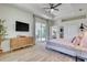 Well-lit bedroom with a sliding glass door to the patio and a view of the kitchen at 122 Arrow Ln, Rotonda West, FL 33947