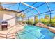 Inviting screened-in pool area with a water feature, perfect for relaxation at 122 Arrow Ln, Rotonda West, FL 33947