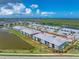 Aerial view of condo complex with lake views in a sunny landscape outlined in red at 14257 Heritage Landing Blvd # 1115, Punta Gorda, FL 33955