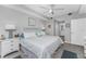 Bright bedroom featuring a ceiling fan, stylish furniture, and a serene ambiance at 14257 Heritage Landing Blvd # 1115, Punta Gorda, FL 33955