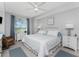 Bright bedroom featuring a ceiling fan, stylish furniture, and a serene ambiance at 14257 Heritage Landing Blvd # 1115, Punta Gorda, FL 33955