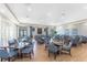 An elegant dining room with tables set for a meal, creating a perfect ambiance for a social gathering at 14257 Heritage Landing Blvd # 1115, Punta Gorda, FL 33955