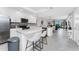 Bright, modern kitchen featuring white cabinets, stainless steel appliances, and a stylish island at 14257 Heritage Landing Blvd # 1115, Punta Gorda, FL 33955