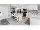 Well-lit kitchen featuring white cabinetry, a stylish backsplash, and stainless steel appliances at 14257 Heritage Landing Blvd # 1115, Punta Gorda, FL 33955