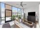 Relaxing screened-in lanai with wicker furniture and a view of the home exterior at 14257 Heritage Landing Blvd # 1115, Punta Gorda, FL 33955