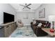 Living room features a flat screen TV, modern furniture, and ample space for entertainment at 14257 Heritage Landing Blvd # 1115, Punta Gorda, FL 33955
