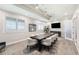 Conference room with a table, chairs, TV, and natural light from windows at 14257 Heritage Landing Blvd # 1115, Punta Gorda, FL 33955