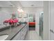 Bright bathroom with dual sinks, neutral countertop, and a glass-enclosed shower at 1470 Hyssop Loop, North Port, FL 34289