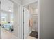 Bright bathroom featuring a shower and doorway to the bedroom at 1470 Hyssop Loop, North Port, FL 34289