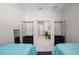 Bedroom with two twin beds separated by a nightstand, a closet, and doorway at 1470 Hyssop Loop, North Port, FL 34289
