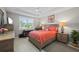 Cozy bedroom with natural light, a comfortable bed, and a view of the outdoors at 1470 Hyssop Loop, North Port, FL 34289