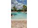 Large outdoor pool featuring clear, refreshing water and ample deck space at 1470 Hyssop Loop, North Port, FL 34289