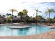 Community pool with seating and lounge chairs for residents to enjoy the sunny weather at 1470 Hyssop Loop, North Port, FL 34289