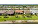 A great lawn with palm trees and manicured landscaping adds curb appeal for this charming single-story home at 1470 Hyssop Loop, North Port, FL 34289