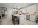Beautiful eat-in kitchen with a large island, stainless appliances, and gray subway tile backsplash at 1470 Hyssop Loop, North Port, FL 34289