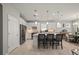 Modern eat-in kitchen with white cabinets, granite counters, and stainless steel appliances at 1470 Hyssop Loop, North Port, FL 34289
