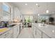 Modern eat-in kitchen featuring granite countertops, stainless steel appliances and pendant lighting at 1470 Hyssop Loop, North Port, FL 34289