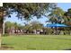 Residents enjoying a friendly game of lawn bowling on a bright sunny day at 1470 Hyssop Loop, North Port, FL 34289