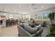 Open living room and kitchen area, with stylish furniture and ample natural light at 1470 Hyssop Loop, North Port, FL 34289