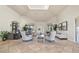 Comfortable lobby with plush seating arrangements, tile flooring, and large windows at 1470 Hyssop Loop, North Port, FL 34289