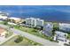 Beautiful aerial view of condo, showcasing landscaping and adjacent waterway at 1500 Park Beach Cir # 5E, Punta Gorda, FL 33950