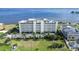 Stunning aerial view of condo building highlighting the well-manicured grounds and parking at 1500 Park Beach Cir # 5E, Punta Gorda, FL 33950