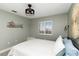 The bedroom is decorated with a coastal theme and white plantation shutters at 1500 Park Beach Cir # 5E, Punta Gorda, FL 33950