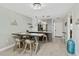 Dining area with breakfast bar and a view of the galley kitchen area at 1500 Park Beach Cir # 5E, Punta Gorda, FL 33950