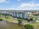 Exterior shot of a waterfront condo building offering beautiful views and lush landscaping at 1500 Park Beach Cir # 5E, Punta Gorda, FL 33950