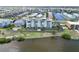 Waterfront building with multiple balconies and landscaping on a sunny day near the water at 1500 Park Beach Cir # 5E, Punta Gorda, FL 33950