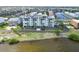 Waterfront building with multiple balconies and landscaping on a sunny day near the water at 1500 Park Beach Cir # 5E, Punta Gorda, FL 33950