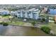 Waterfront building with multiple balconies and landscaping on a sunny day near the water at 1500 Park Beach Cir # 5E, Punta Gorda, FL 33950