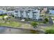 Waterfront building with multiple balconies and landscaping on a sunny day near the water at 1500 Park Beach Cir # 5E, Punta Gorda, FL 33950