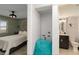 Hallway leading to bedroom and bathroom featuring sleek lighting and interior design at 1500 Park Beach Cir # 5E, Punta Gorda, FL 33950