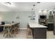 A sleek kitchen with a large countertop, stainless steel appliances, and stylish hanging lights creating an inviting space at 1500 Park Beach Cir # 5E, Punta Gorda, FL 33950