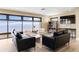 This spacious living room has water views from the oversized windows at 1500 Park Beach Cir # 5E, Punta Gorda, FL 33950