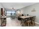 Spacious and well-lit living room with a large window and dining area at 1500 Park Beach Cir # 5E, Punta Gorda, FL 33950