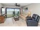 Comfortable living room with sofa and balcony access provides open, relaxing atmosphere at 1500 Park Beach Cir # 5E, Punta Gorda, FL 33950