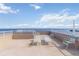 Inviting rooftop deck with ample seating and panoramic ocean views at 1500 Park Beach Cir # 5E, Punta Gorda, FL 33950