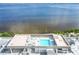 Rooftop pool area offering stunning water views and lots of space to relax at 1500 Park Beach Cir # 5E, Punta Gorda, FL 33950