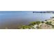 Breathtaking waterfront view featuring lush vegetation and calm blue waters on a sunny day at 1500 Park Beach Cir # 5E, Punta Gorda, FL 33950
