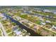 Aerial view of the property showing water access and outdoor amenities at 15698 Meacham Cir, Port Charlotte, FL 33981