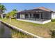 This home has a great screened in pool that overlooks the canal! at 15698 Meacham Cir, Port Charlotte, FL 33981